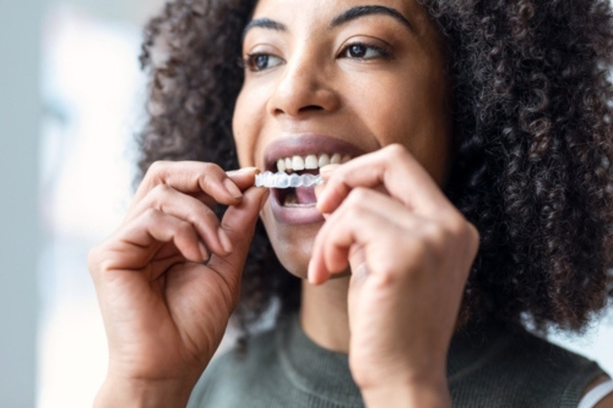 Patient with Invisalign aligners in Collingwood dental clinic