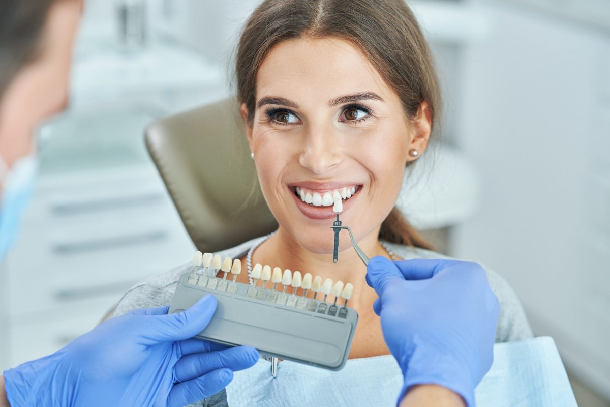 Dentist applying veneers near Elwood dental clinic