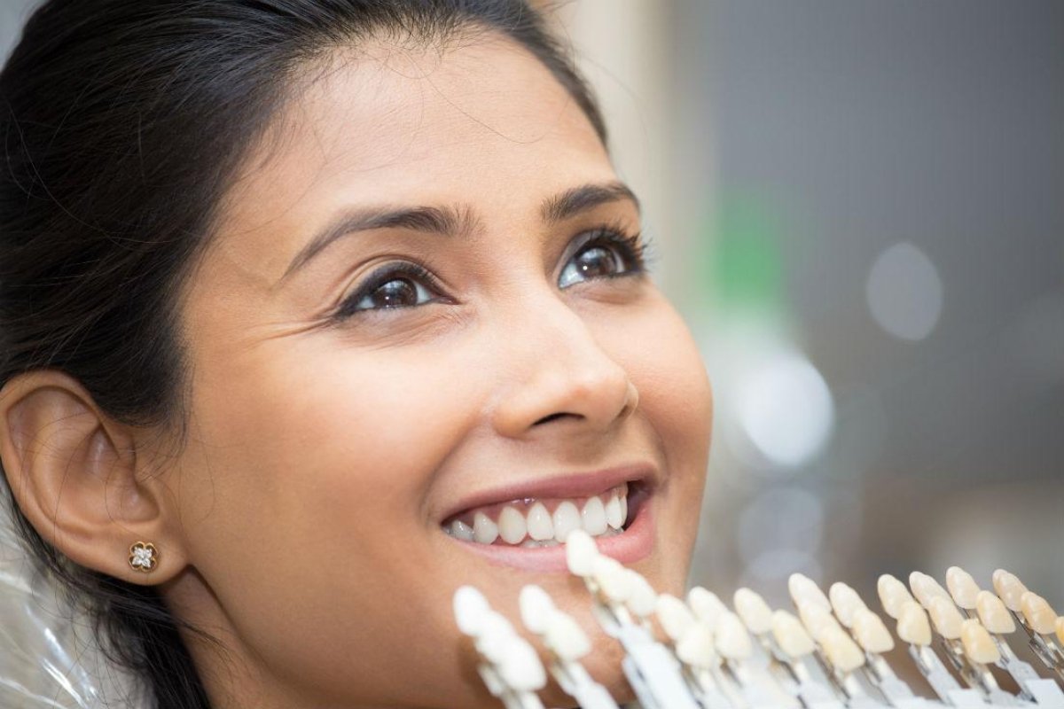 Dentist applying veneers near Malvern